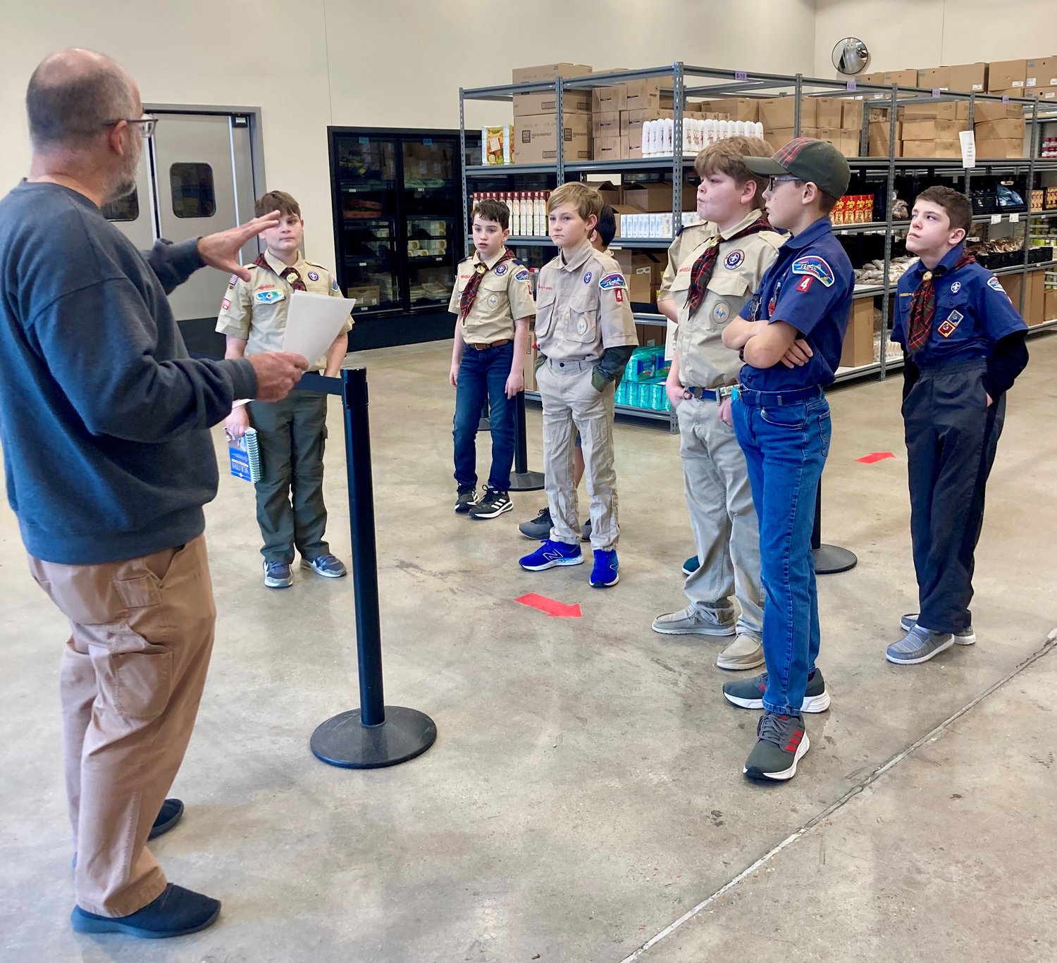 Members of Cub Scout Pack 4 from St. Peter Parish in Jefferson City tour the food pantry in the Catholic Charities Center in Jefferson City in January 2023.